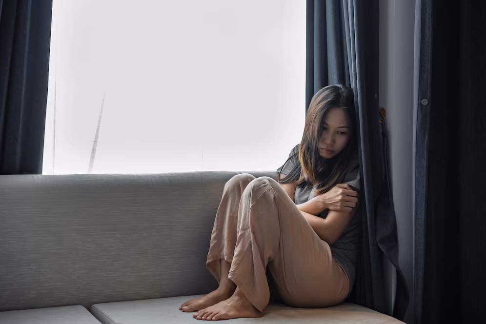young-woman-sitting-sofa-home_1048944-25855879